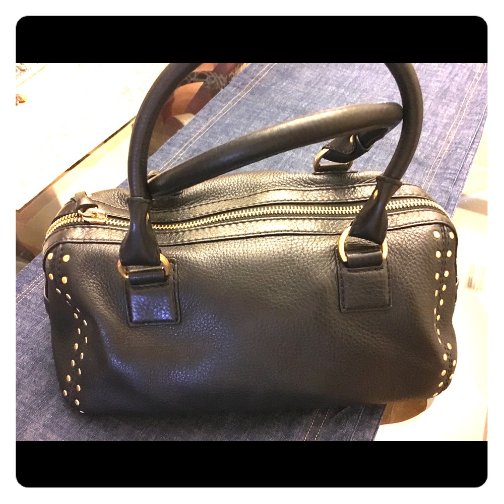 Black MK bowling style bag with gold grommets